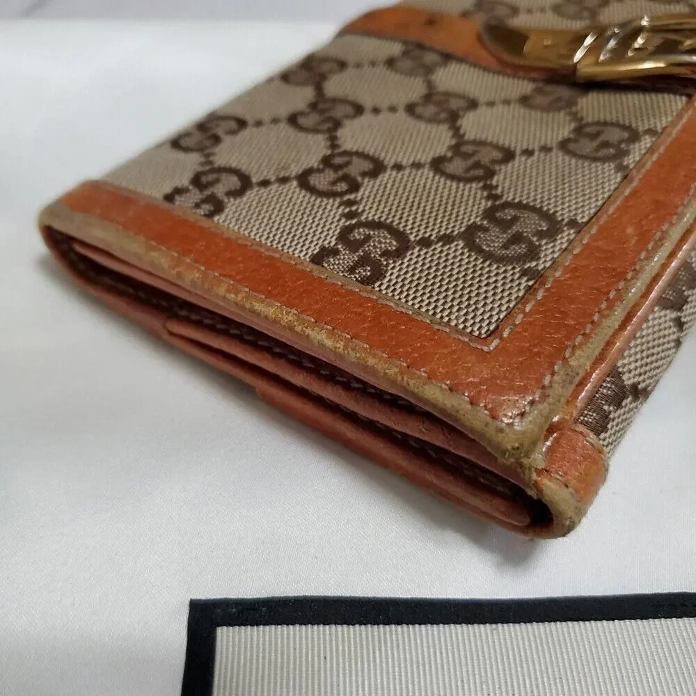 Gucci GG Logo Continental Canvas Tan Bifold Wallet with Leather Trim. 1462012778